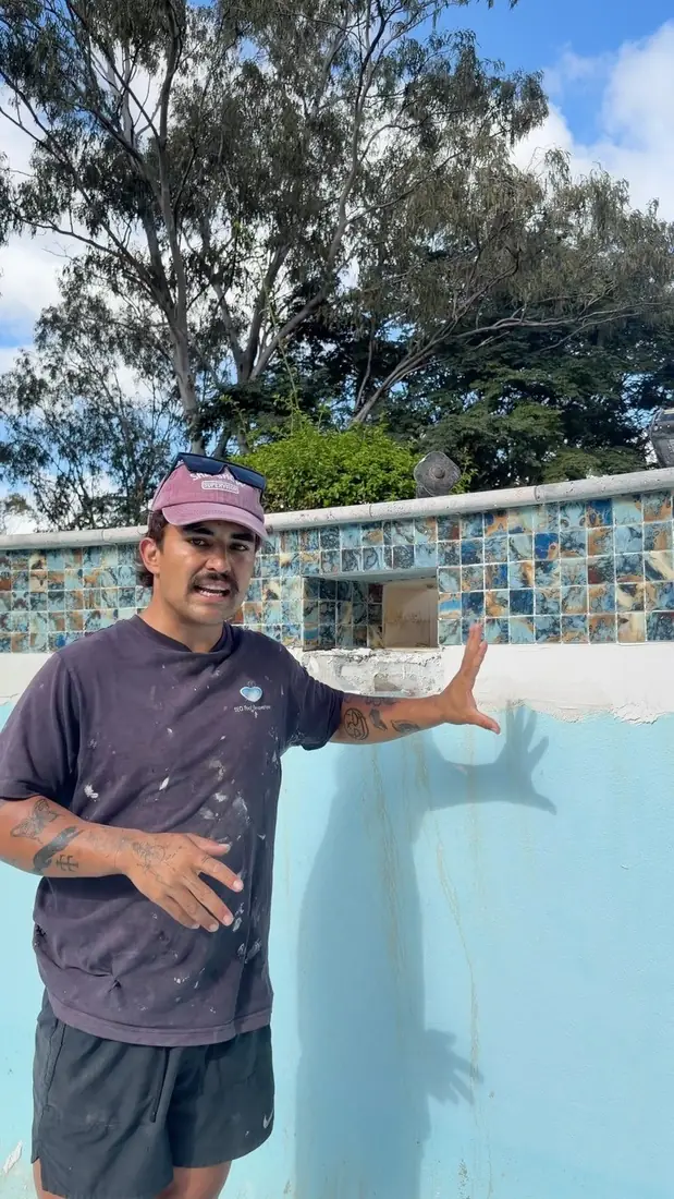 Kieran from SEQ Pool Renovations standing in a pool mid-renovation