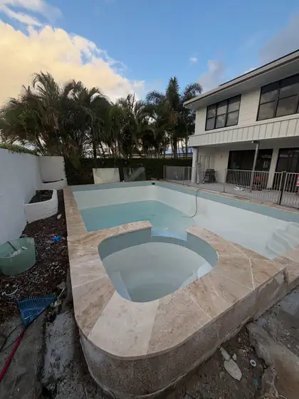 Tallai: pool and spa, travertine coping
