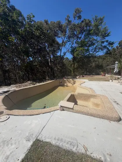 Tallai: day one, new porcelain coping and glass to come