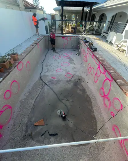 First renovation underway: surrounds, coping, new step and pebblecrete