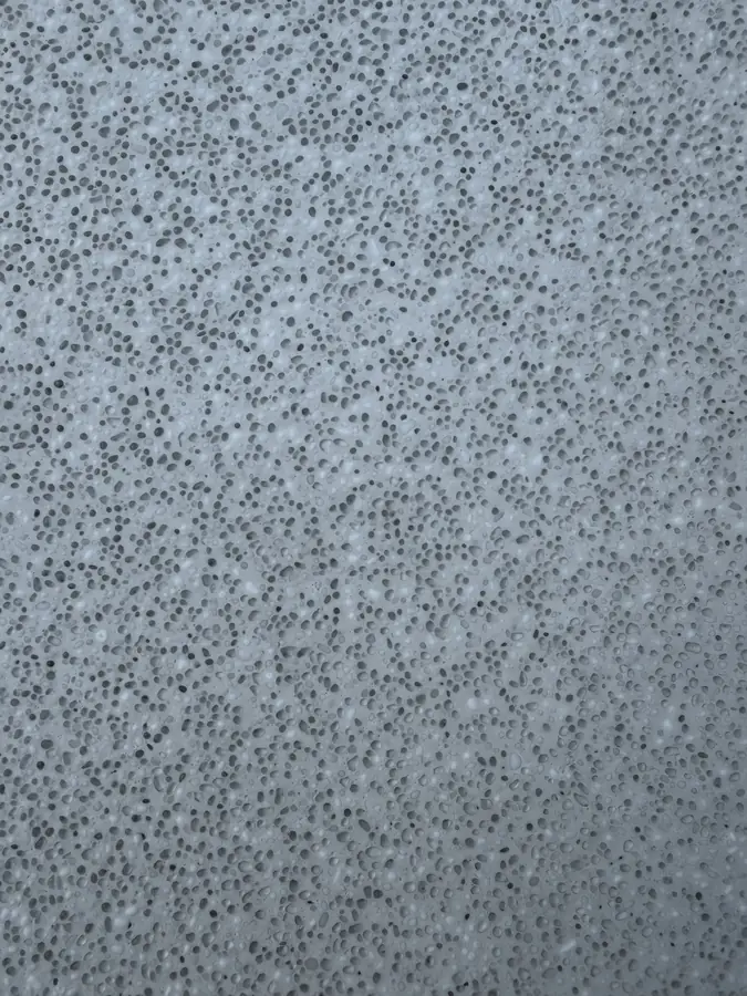 Close-up of a 50% white, 50% clear glass pool interior