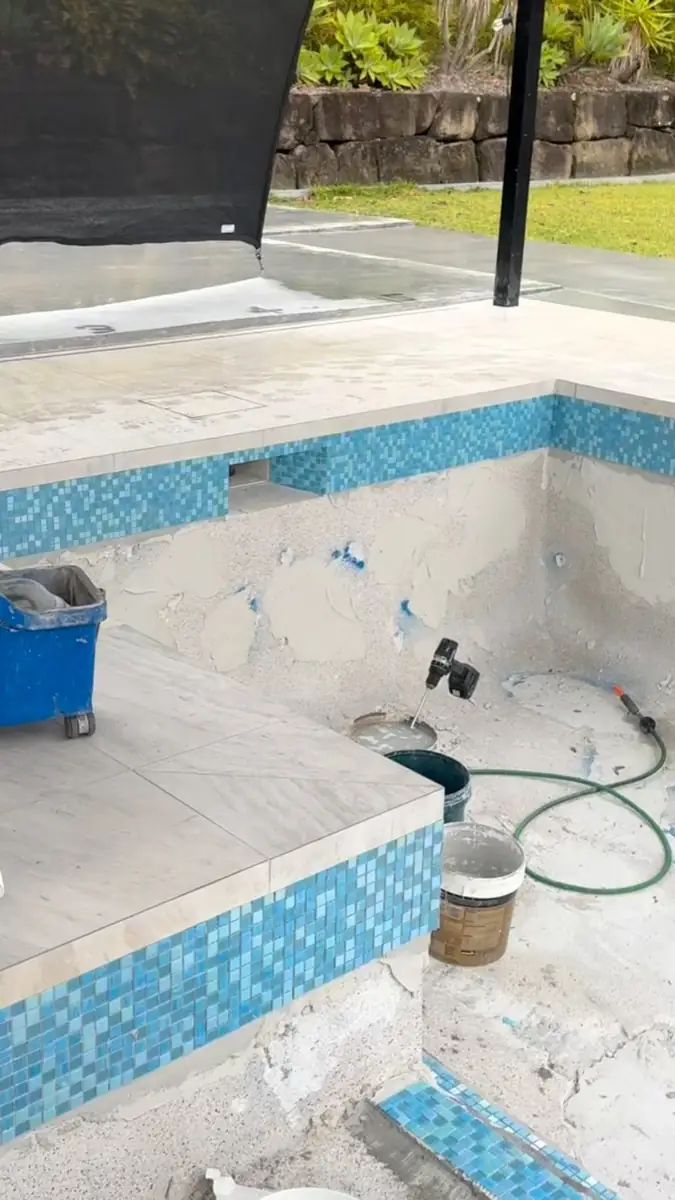 Epoxy grout going into new waterline tiles